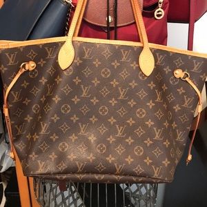 Louis Vuitton purse with matching wallet.